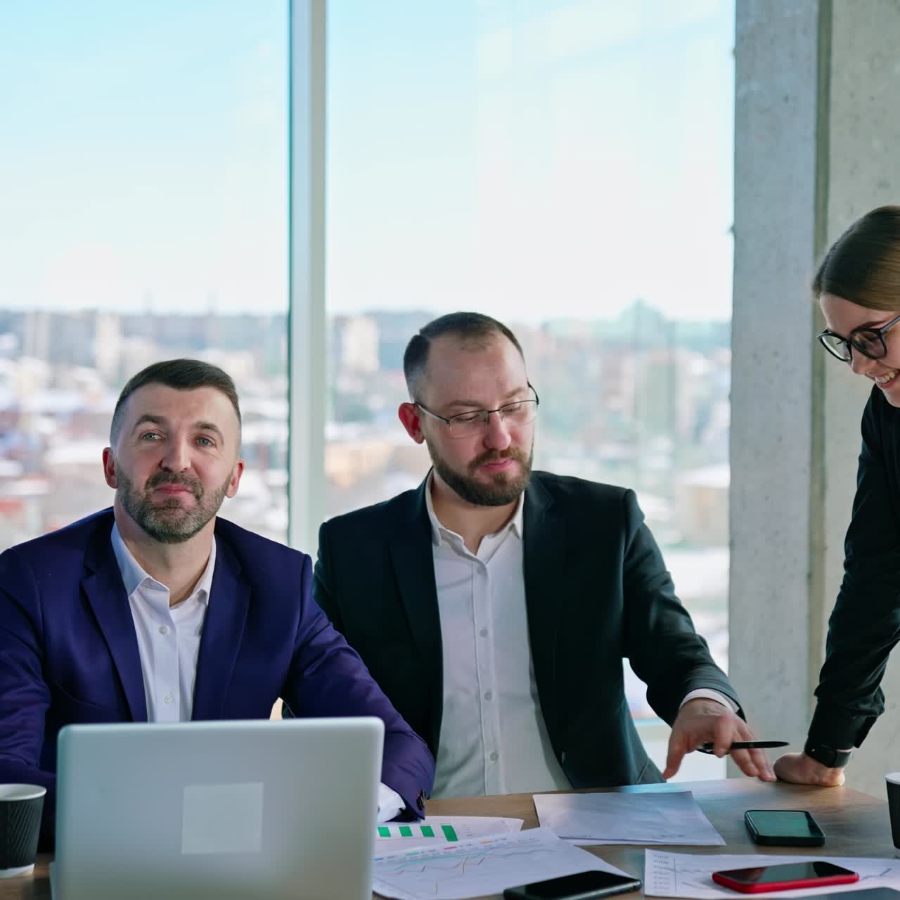 Business people create new strategy. Teamwork of young entrepreneurs man and woman at table thinking about new business project in modern office