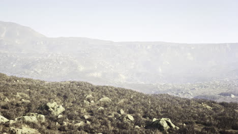 mountainous landscape featuring rocky terrain and distant ridges during daytime