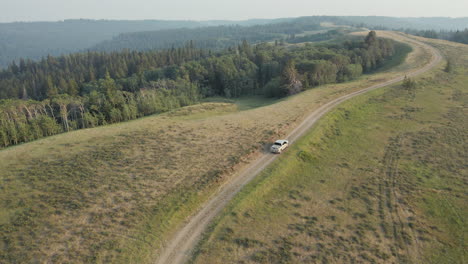 pickup truck driving on mountain pass near saskatchewan, canada