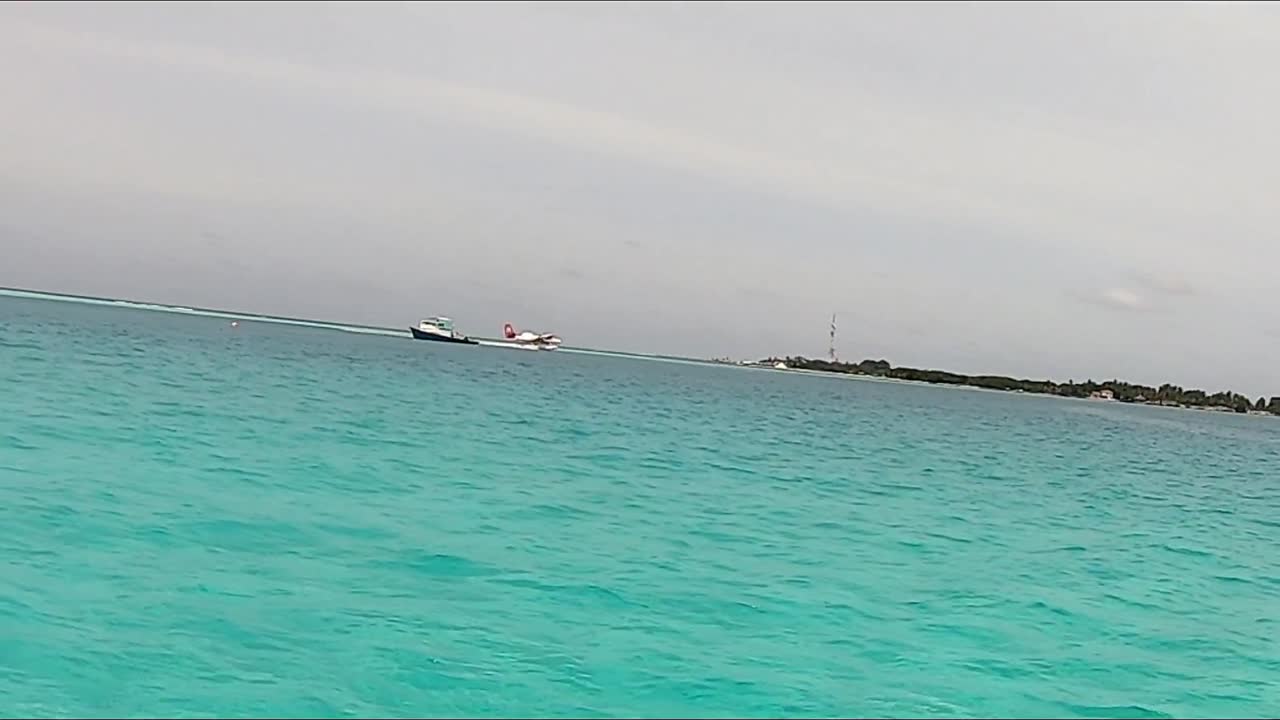 Seaplane Landing in Turquoise Water