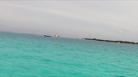 seaplane landing in turquoise water