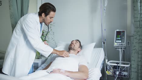 médicos jóvenes examinando a un paciente en una cama de hospital 4k