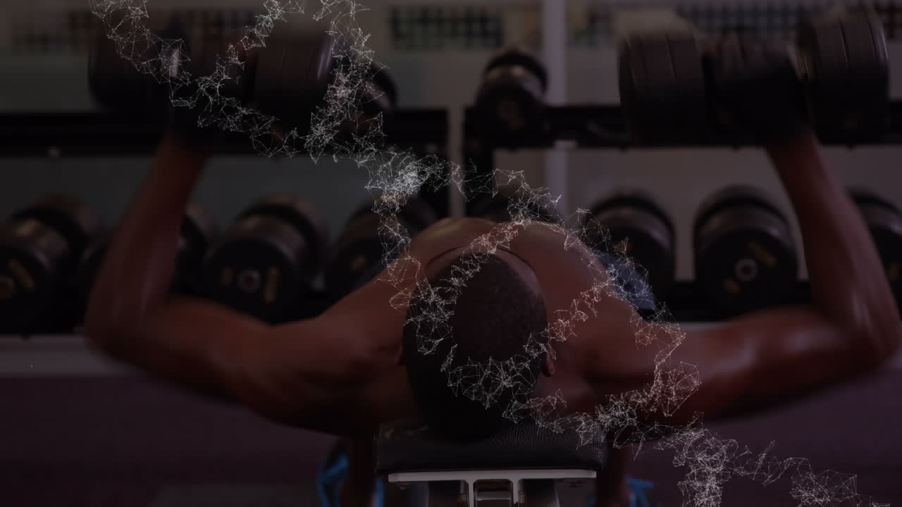 dna 가닥이 회전하는 애니메이션 체력 있는 남자가 무게로 운동하고 있습니다.