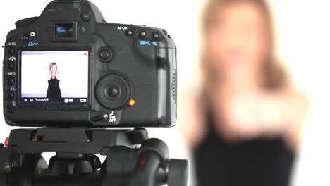 camera taking shot of blonde woman posing