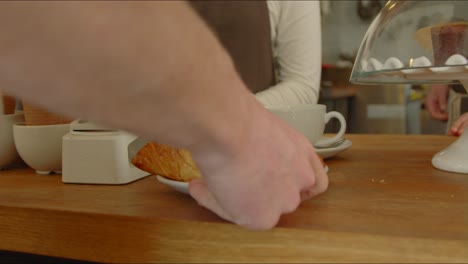 Man-Carries-Away-Croissant-and-Coffee-02