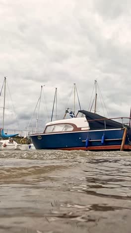 waves gently move boats in scottish harbor