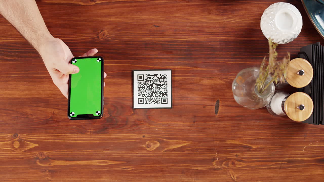 Hand Using Smartphone with Green Screen to Scan QR Code