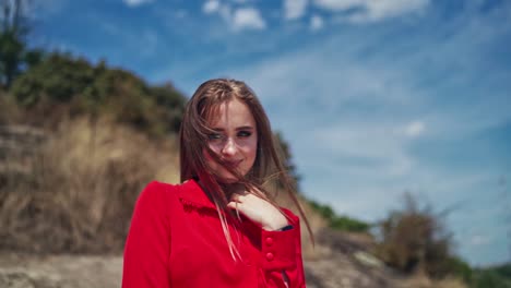 beautiful female model outdoor. portrait view of young woman posing in beautiful mountains