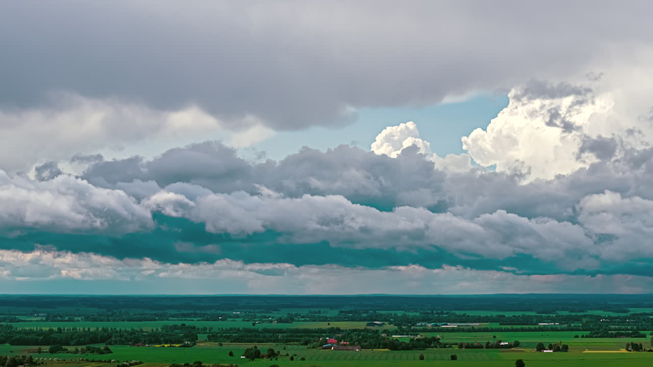 Wide expanse of Nimbostratus clouds over rural village countryside timelapse hyperlapse