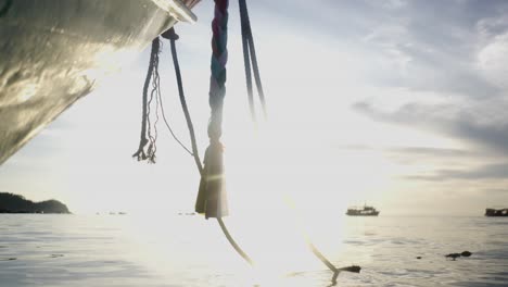 bright sun reflection on calm ocean surface with distant boats