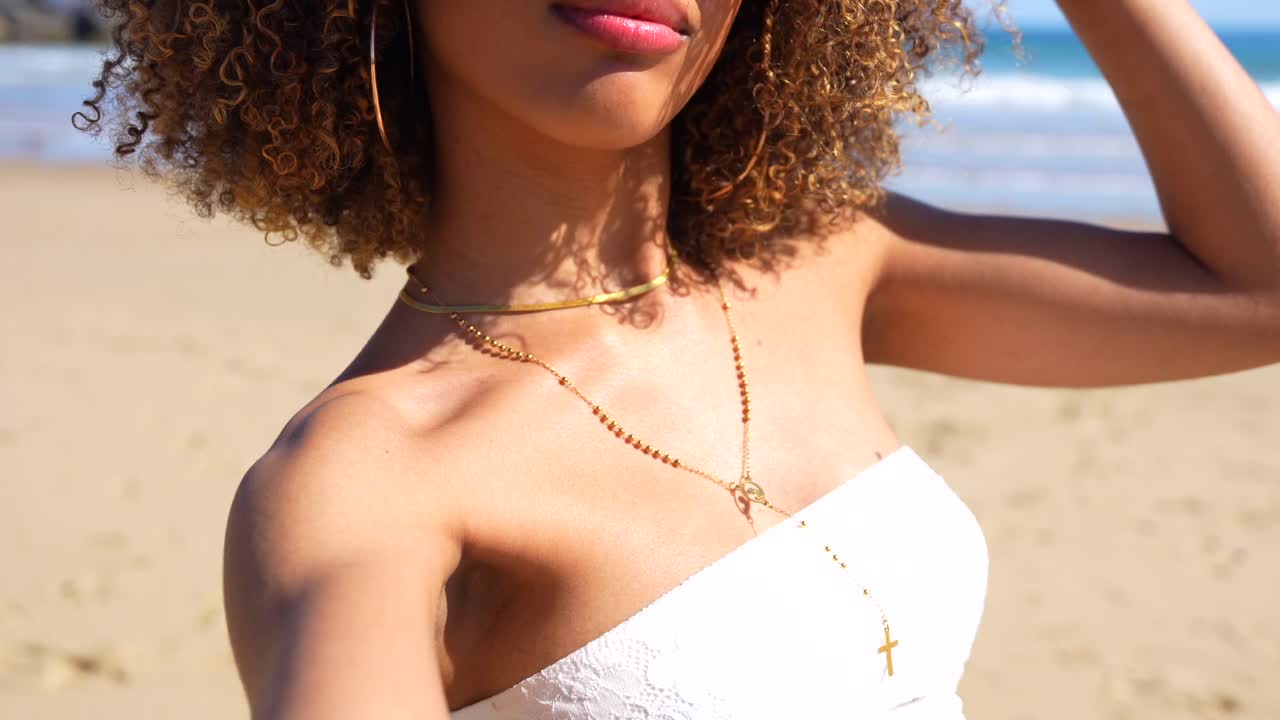 Woman with Curly Hair on the Beach