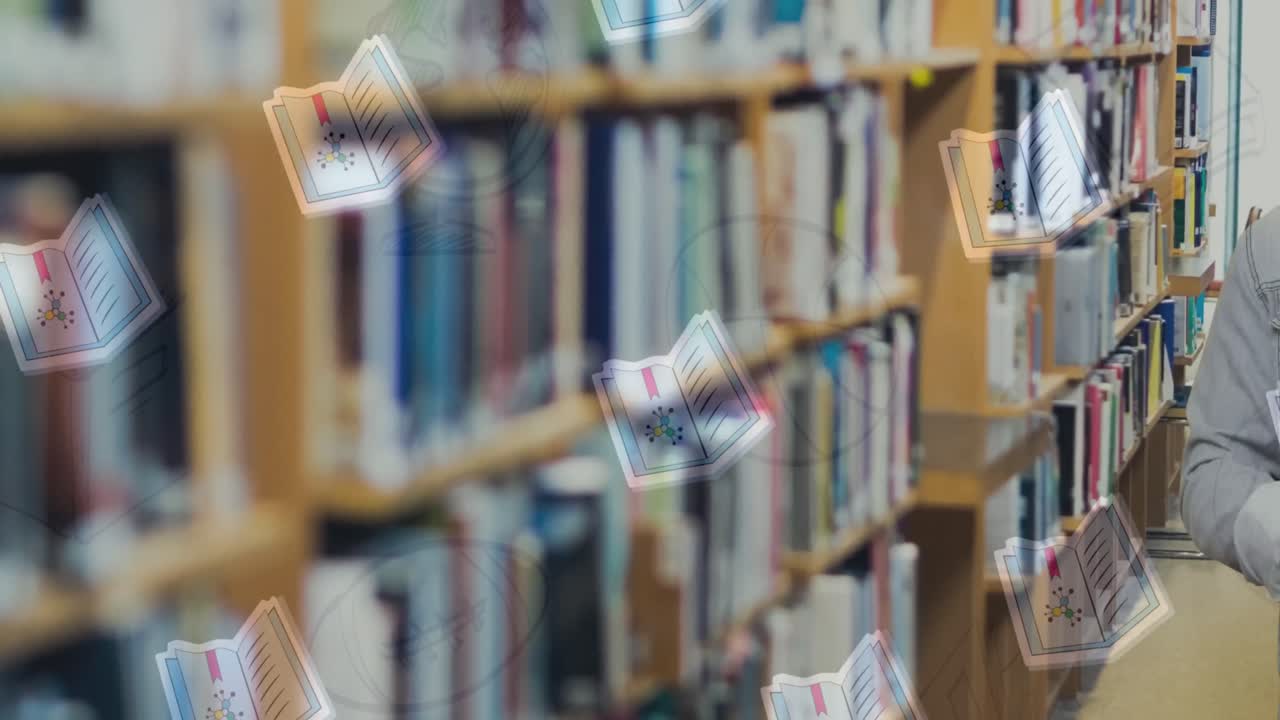 Animation of book icons over smiling caucasian man with books in library