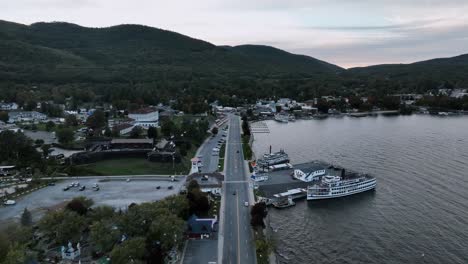 lake george town, road and cruise line port during sunset in new york, usa