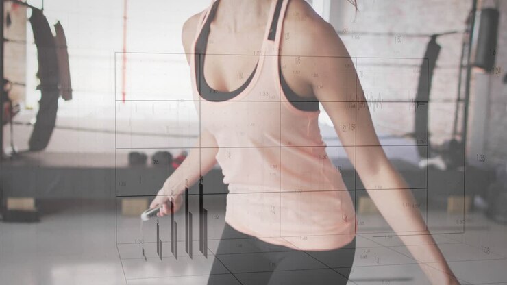 Donna che fa fitness saltando la corda su un tappetino, avviando una sovrapposizione del grafico a impulsi che tiene traccia delle prestazioni