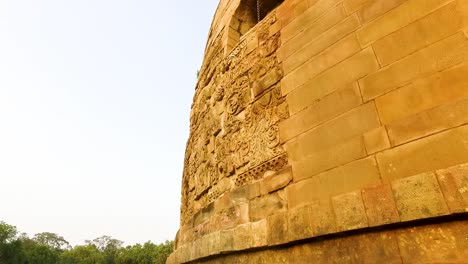 the historical ancient ruins of dhamek stupa with floral carvings in sarnath, varanasi, india