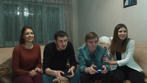 friends playing video games at home