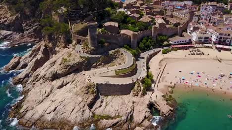 Flying-next-to-a-castle-on-the-rocky-coastline-of-the-Mediterranean-Sea