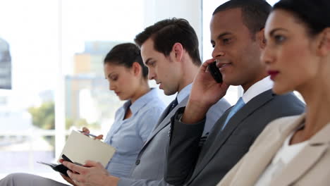 Business-people-sitting-and-waiting