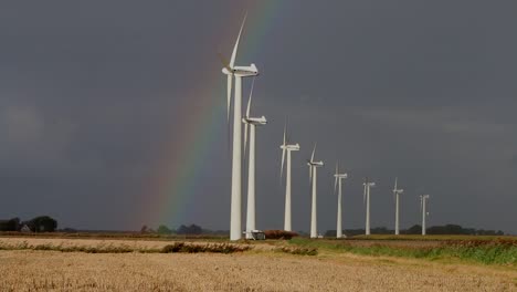 stormy sky and rainbow over a row of