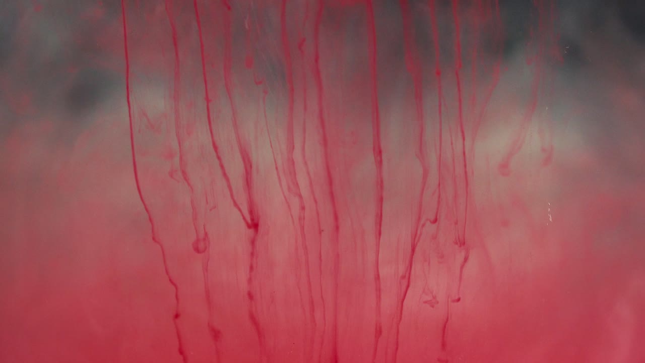 Abstract Red Liquid Swirling in Water