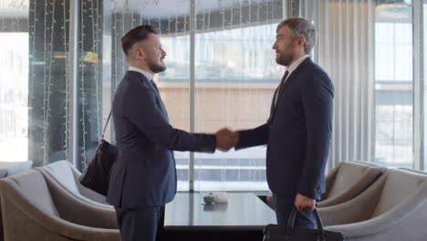 cinemagraph of businessmen shaking hands