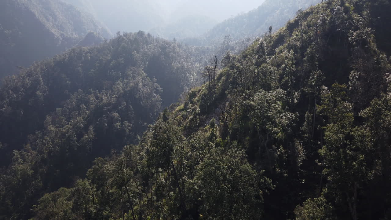 Treetop flyover, epic hills seen from cable car heading up to Fanispan, SAPA, Vietnam, incredible views of misty mountains