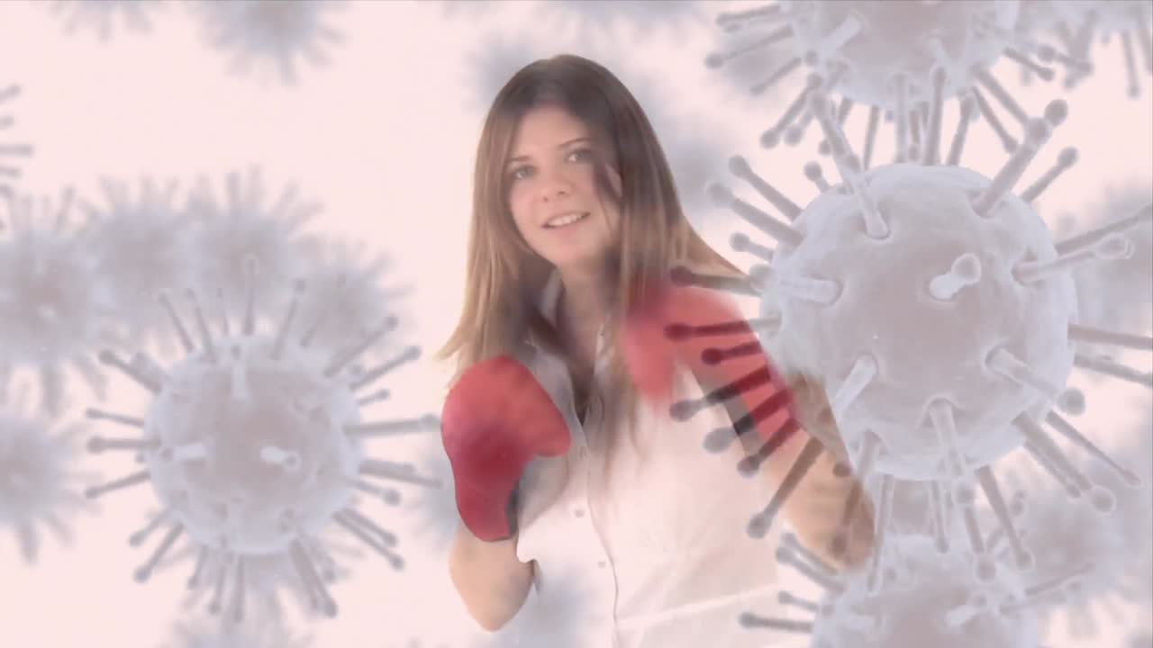 animación de la propagación del coronavirus con una chica boxeadora en el fondo