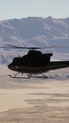 helicopter flying over desert landscape