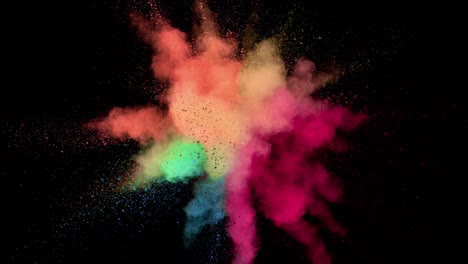 super slow motion of colored powder explosion isolated on dark background.