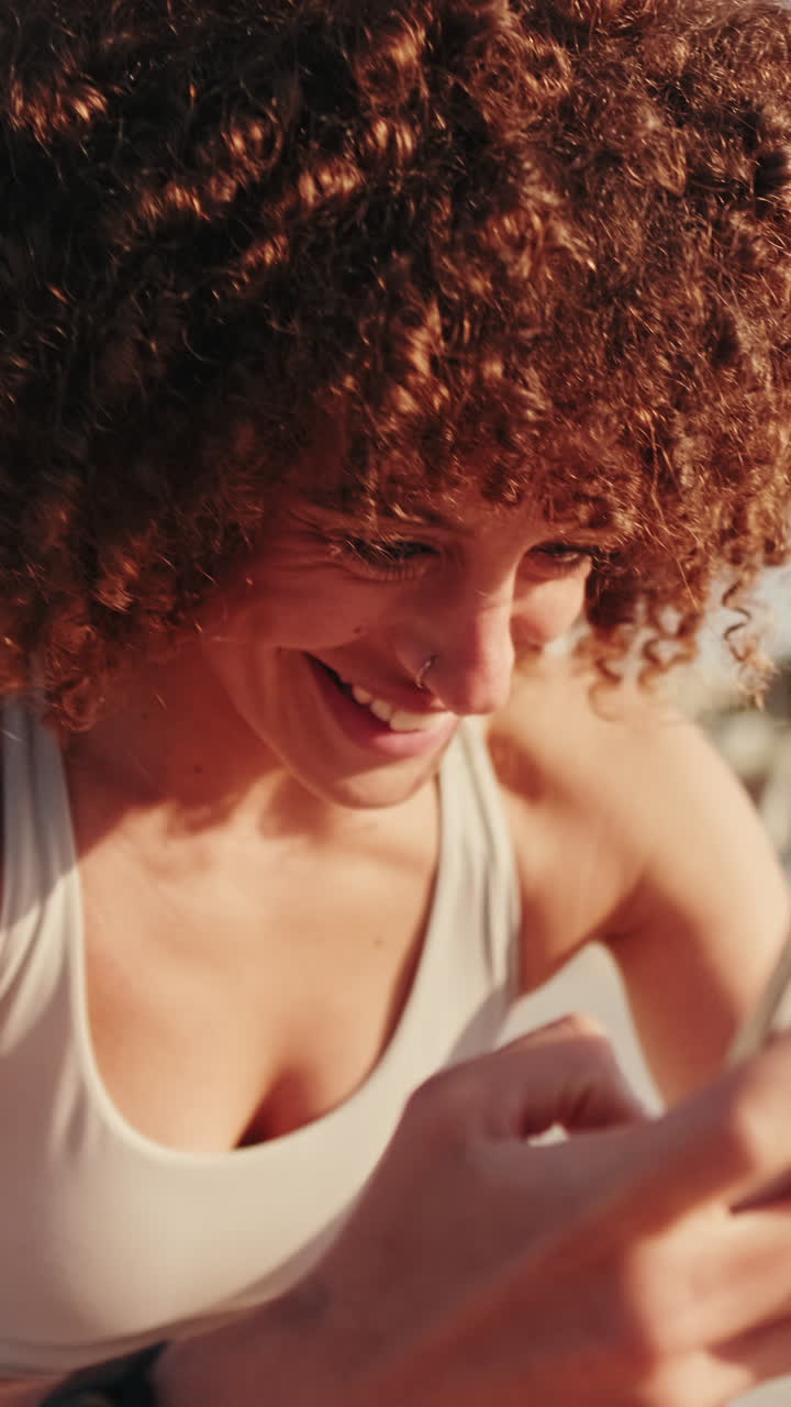 Sportswoman Using Smartphone After Workout