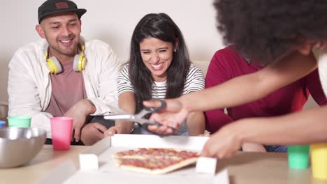 friends enjoying pizza together at home