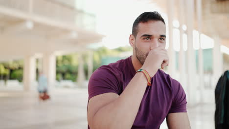 Young-man-drinking-coffee-to-go-outdoors.