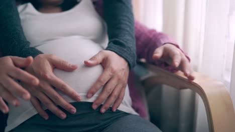 Pregnant-couple-feels-love-and-relax-at-home.