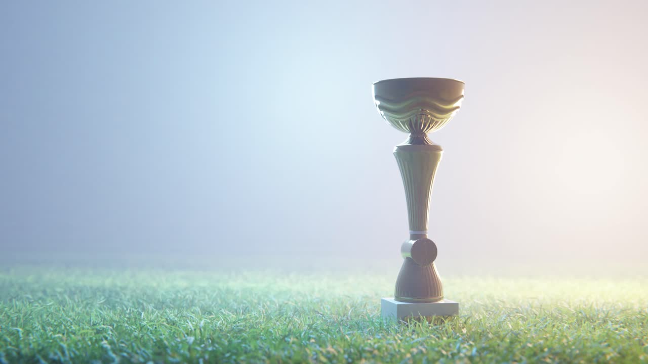 Golden Award Trophy on Grassy Field with Foggy Background