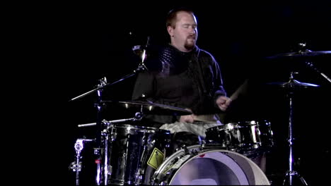 a musician plays the drums