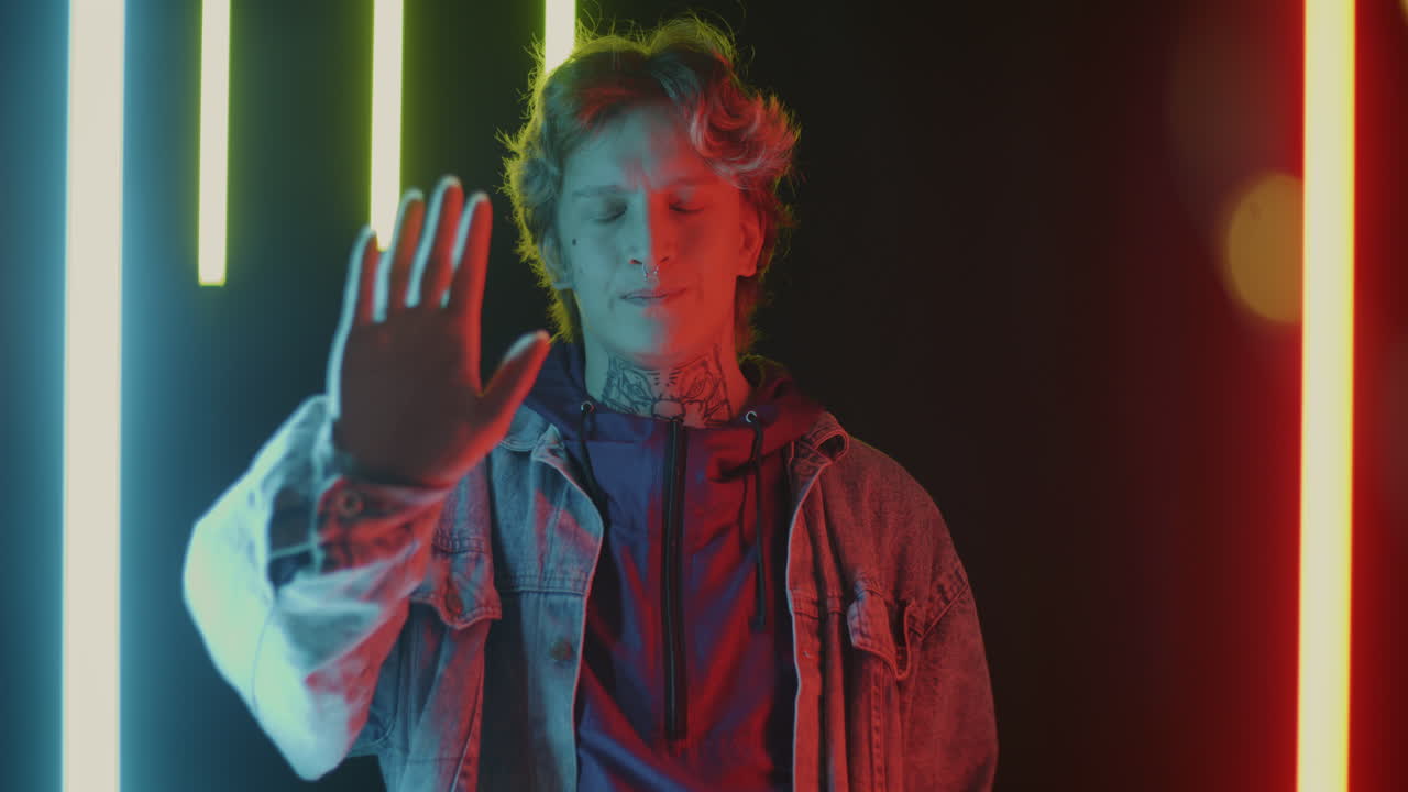 Young Man with Tattoos and Neon Lights