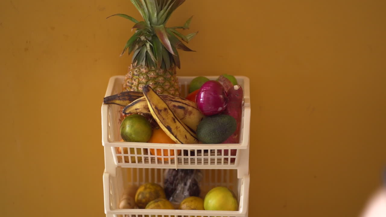 Taking orange from latin fruit basket