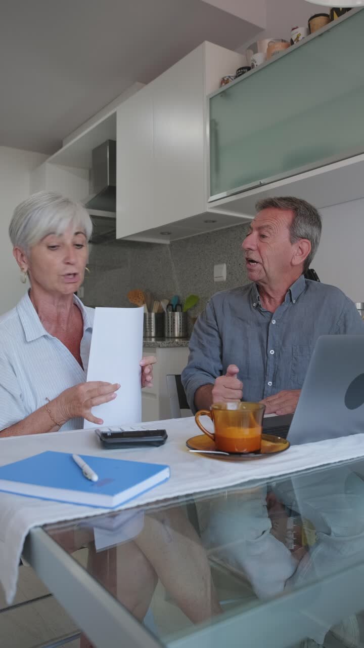 Senior couple discussing finances at home
