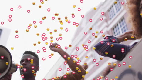 animation of media icons over biracial people with signs protesting