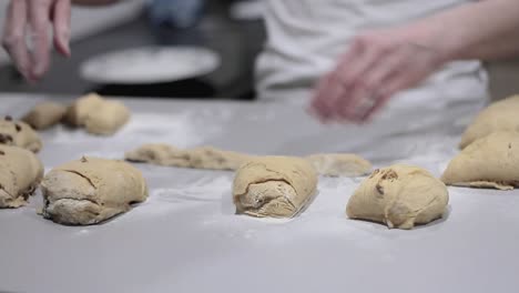 woman in kitchen kneading dough for bread and pizza stock video