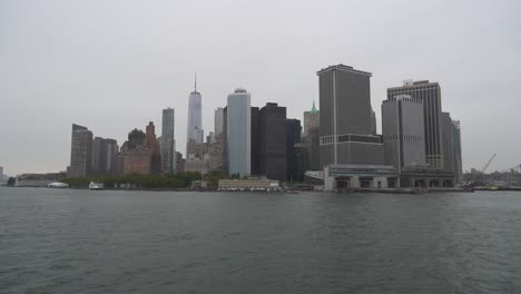 new york city skyline from the water on a cloudy day