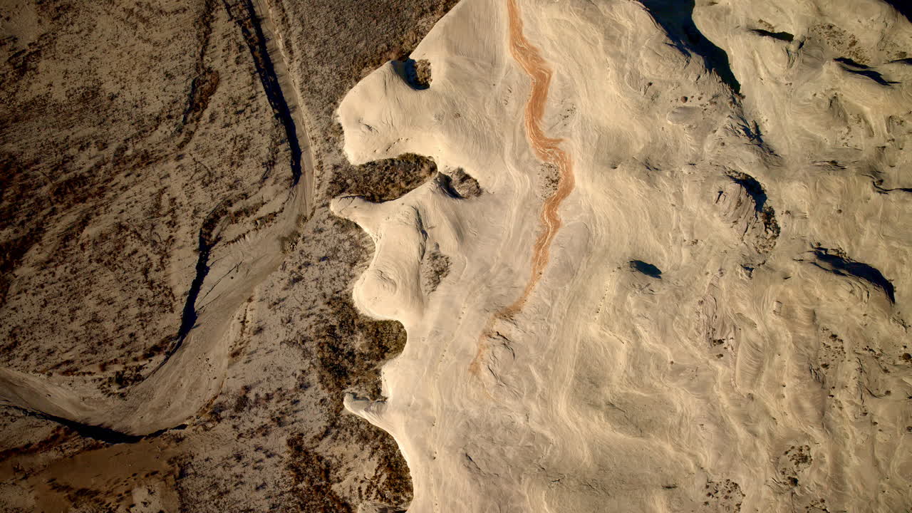 Drone footage captures the approach to striking rock features by Lake Powell in Page, Arizona.