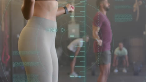 animation of data processing over diverse woman and man jumping rope cross training at gym