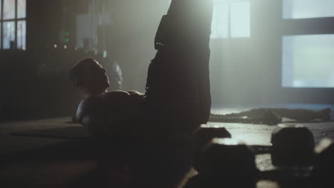 man doing crunches in a gym