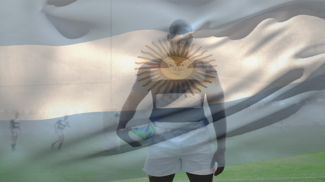 Animation of argentina flag and african american male player with rugby ball standing on ground