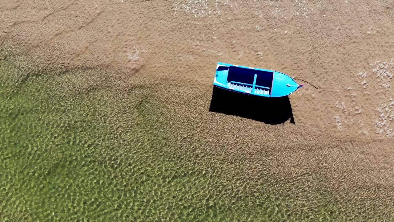 Boat Alone on the Shore in a Low Tide in Algarve