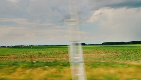 the countryside of hungary viewed from the window of a fast-moving car 4