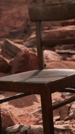 old wooden chair on rocks of grand canyon