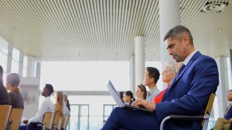 businessman using laptop in the business seminar 4k