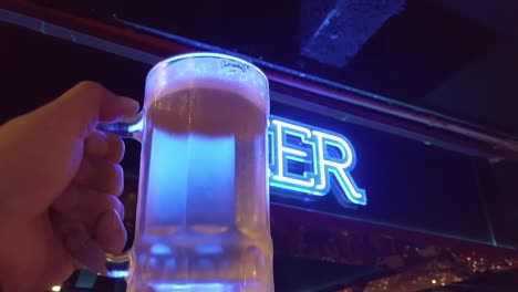 glowing neon beer bar signboard at balneario camboriu, santa catarina, brazil